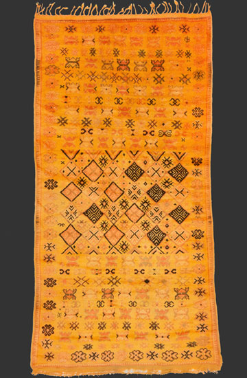 TM 2319, Ait Ouaouzguite pile rug with a wonderful warm yellow ground colour, a balanced design with a central squarish 'medaillon' filled with geometric Berber motifs embedded in a field with motifs mostly borrowed from urban Rabat rugs, Jebel Siroua region near Tazenakht / Anti-Atlas, #Morocco, mid 20th century, 305 x 160 cm / 10' x 5' 4'', high resolution image + price on request